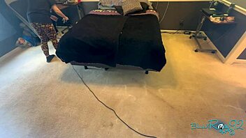 brunette milf housewife vacuums bedroom corners meticulously long hair swaying