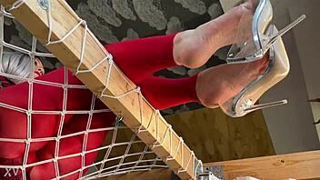 bare feet dangle clear high heels closeup