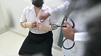 Doctor examines and treats patient carefully in hospital setting.