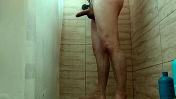 Guy jerks off passionately while showering at home