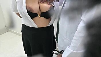 Doctor examines and treats patient carefully in hospital setting.