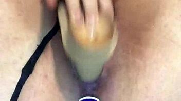 She plugs her ass and rides giant dildo wildly