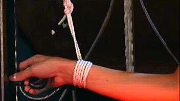 brunette college coed bound in corset rides big cock doggystyle