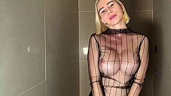 Busty beauty teases wet curves in shower