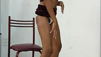 Latina brunette shakes natural tits and sexy ass