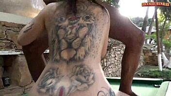 Tattooed latina bent over pool table takes big cock doggystyle