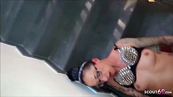 chatting casually with slim german petite tattooed milf on the staircase