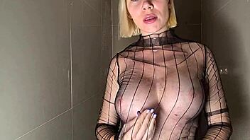 Busty beauty teases wet curves in shower