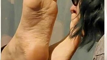 taking time to gently lick her soft feet