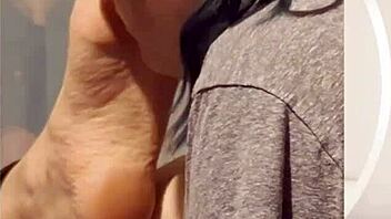 taking time to gently lick her soft feet