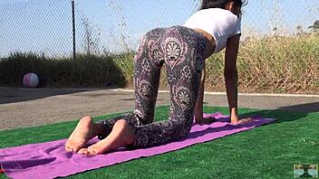 sexy asian filipina teen stretches yoga pants in public outdoor workout