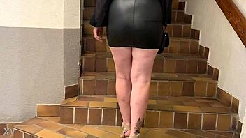 my wife struts in mini leather dress and sexy heels