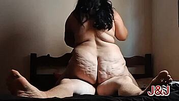 Tattooed chubby Brazilian femdom rides bull on bed