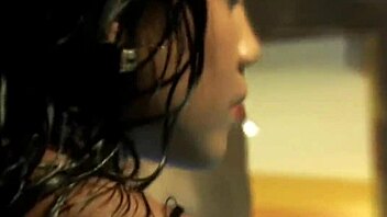 seductive asian brunette dances nude teasing her curves