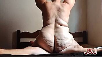 Tattooed chubby Brazilian femdom rides bull on bed