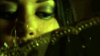 Brunette slips into her sleek BLACK DRESS elegantly