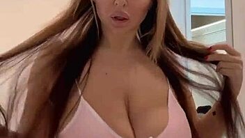 rabbit toy teases her massive natural boobs seductively