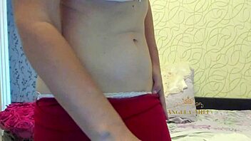 horny mature brunette with hairy pussy strips on couch for fans