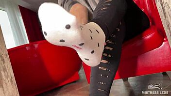 goddess teases wrinkled feet in socks barefoot under desk closeup