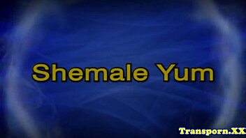 hey bigtit tgirl strokes her oiled tattooed cock hard