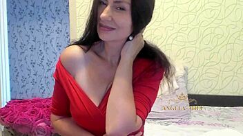 horny mature brunette with hairy pussy strips on couch for fans