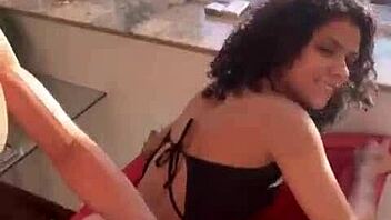 A Brazilian couple fucks bareback at the window for neighbors