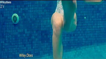 preview of hot wife flashing big tits in one-piece swimsuit at hotel pool