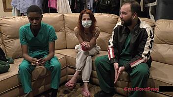 Doctor tampa's nurse jewel examines masked ebony patient desk