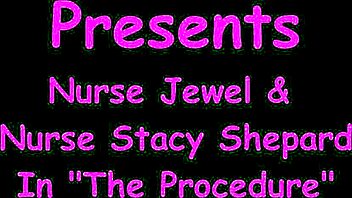 Doctor tampa's nurse jewel examines masked ebony patient desk