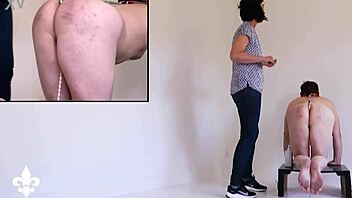 bound slave's harsh caning twists into shocking fisting torment part one