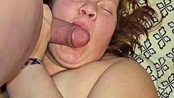 oh fuck yes dirty milf slurps big cock between her huge tits!