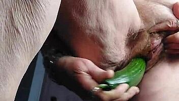 granny shoves cucumber deep in her hairy old beaver