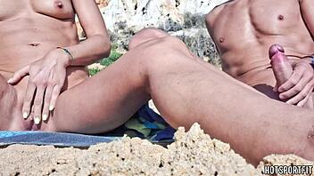 sporty couple flashes juicy pussy cock on public beach handjob