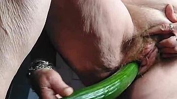 granny shoves cucumber deep in her hairy old beaver
