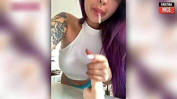 purple-haired stunner delivers a teasing deep slow blowjob up close