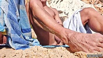 sporty couple flashes juicy pussy cock on public beach handjob