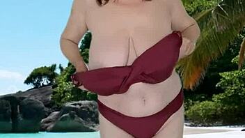 Chubby granny teases huge tits in sexy bikini