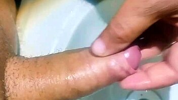 Hidden guy in bathroom sink spurts cum watching exotic Asian slave shower