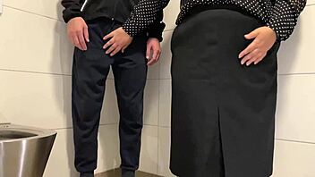 Watch This Juicy Milf Stroke Cock in Public Toilet!