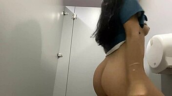 that naughty nurse fingers herself squirting wildly in bathroom