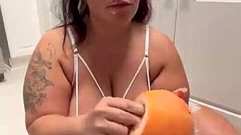 curvy bbw teases her huge tattooed ass with fetish fruit play