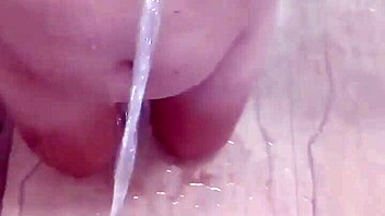 guy unleashes golden shower on her big tits