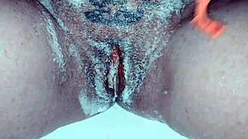 Milf soaps up her shaved pussy nice and close! 🧼🍑