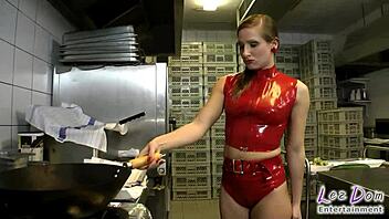 stuffing this latex slut's pussy with cucumber punishment