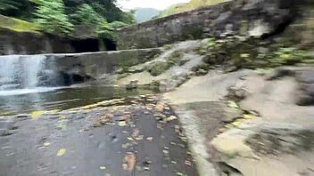 Friends splash and play wet in Brazilian waterfall bath
