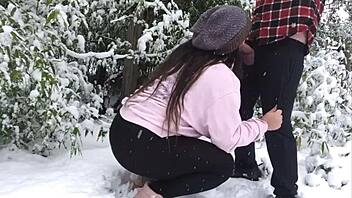 real couple enjoys snowy outdoor adventure together.