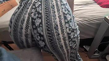 clothed woman grinds ass on partner's lap rhythmically