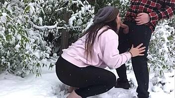 real couple enjoys snowy outdoor adventure together.