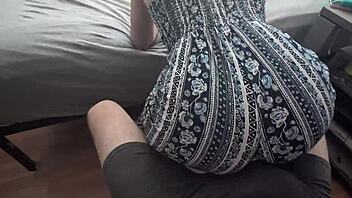 clothed woman grinds ass on partner's lap rhythmically