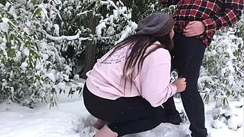 real couple enjoys snowy outdoor adventure together.